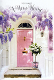 Captured here is a tender De Beauvoir Town doorway scene where pastel colour and flowers together evoke the emotion of a new beginning. The focal point is a pale pink front door, painted in a soft, almost chalky shade that glows gently against the whitewashed wall and a lightly tinted shutter. Overhead, clusters of wisteria in tones of lavender and lilac spill down in loose, trailing garlands, their blossoms forming an airy, fragrant frame above the entrance that brings to mind the tree-lined streets and characterful terraces of this part of East London. On the doorstep below, a simple grey metal bucket has been turned into a welcoming floral arrangement, generously filled with white and cream roses. Each rose bloom appears full and velvety, their petals layered in tight swirls, with pockets of fresh green foliage threaded between them to add texture and a hint of woodland freshness. A narrow pink ribbon is tied around the bucket, its hue echoing the door and its bow resting casually against the stone, as if someone arranged it just seconds before stepping inside. The light falls in a soft, diffused way, throwing gentle shadows from the wisteria and the handle of the bucket while illuminating the creamy edges of the petals. The scene feels peaceful and full of anticipation at once: you can almost hear the quiet of a side street near the canal, sense the first night in a new home, and imagine the comfort of walking up to this doorway after a long day. It's an understated yet deeply expressive housewarming arrangement, the kind of floral gesture that makes a De Beauvoir Town entrance feel immediately, irrevocably, like home.